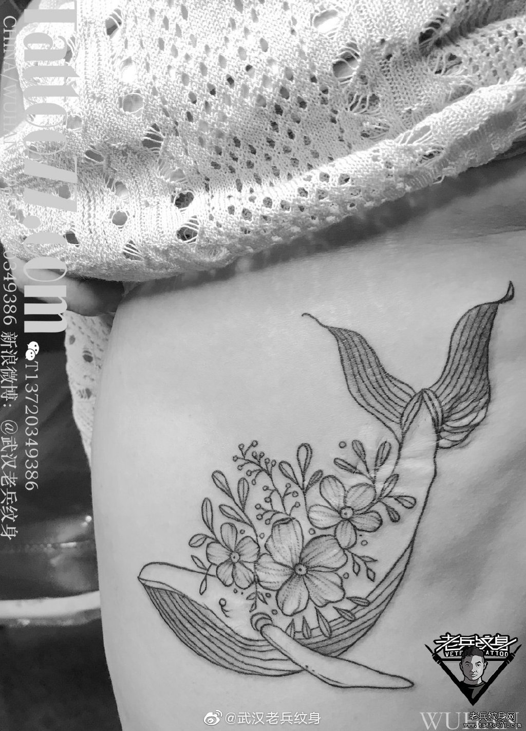 黑灰鲸鱼花卉纹身作品