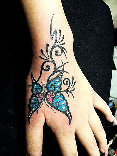 湖北随州文身店:一款超酷的虎口蝴蝶纹身图案图片